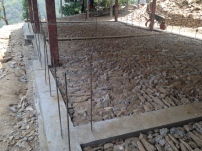 Building Two, with both foundation pours complete, stone sub-grade for the classroom flooring complete, and all ready for bricks!